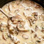 Cream of mushroom soup with slices of mushroom.