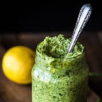 Jar filled with garlic scape pesto.