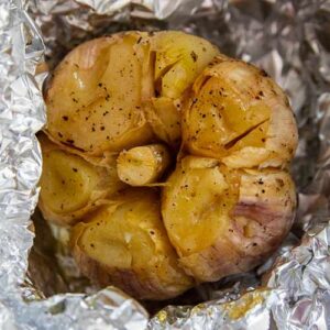 Roasted garlic in tin foil.